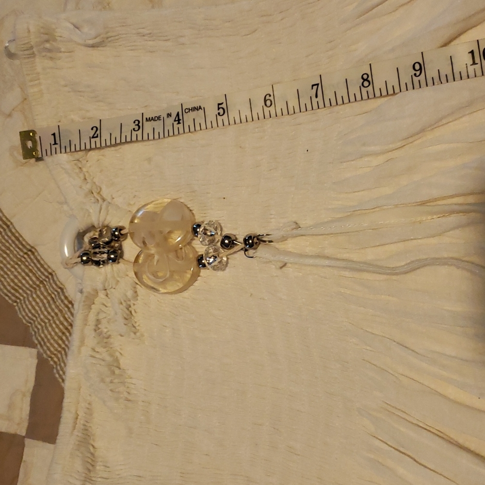 Like new strapless dress with fun bling on front. Bust stretches to 18.5"